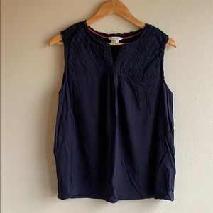 Sleeveless navy blue tee with embroidered yoke
